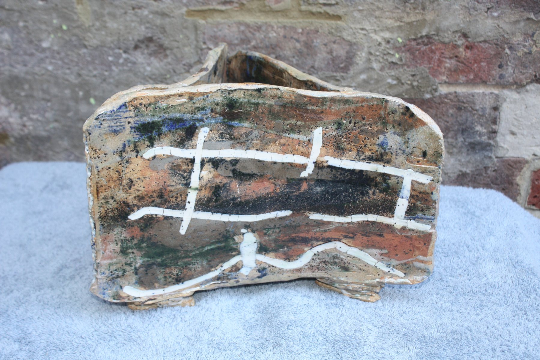 Triangular Strata Pot with inlaid porcelain and oxides by Graham Matthews