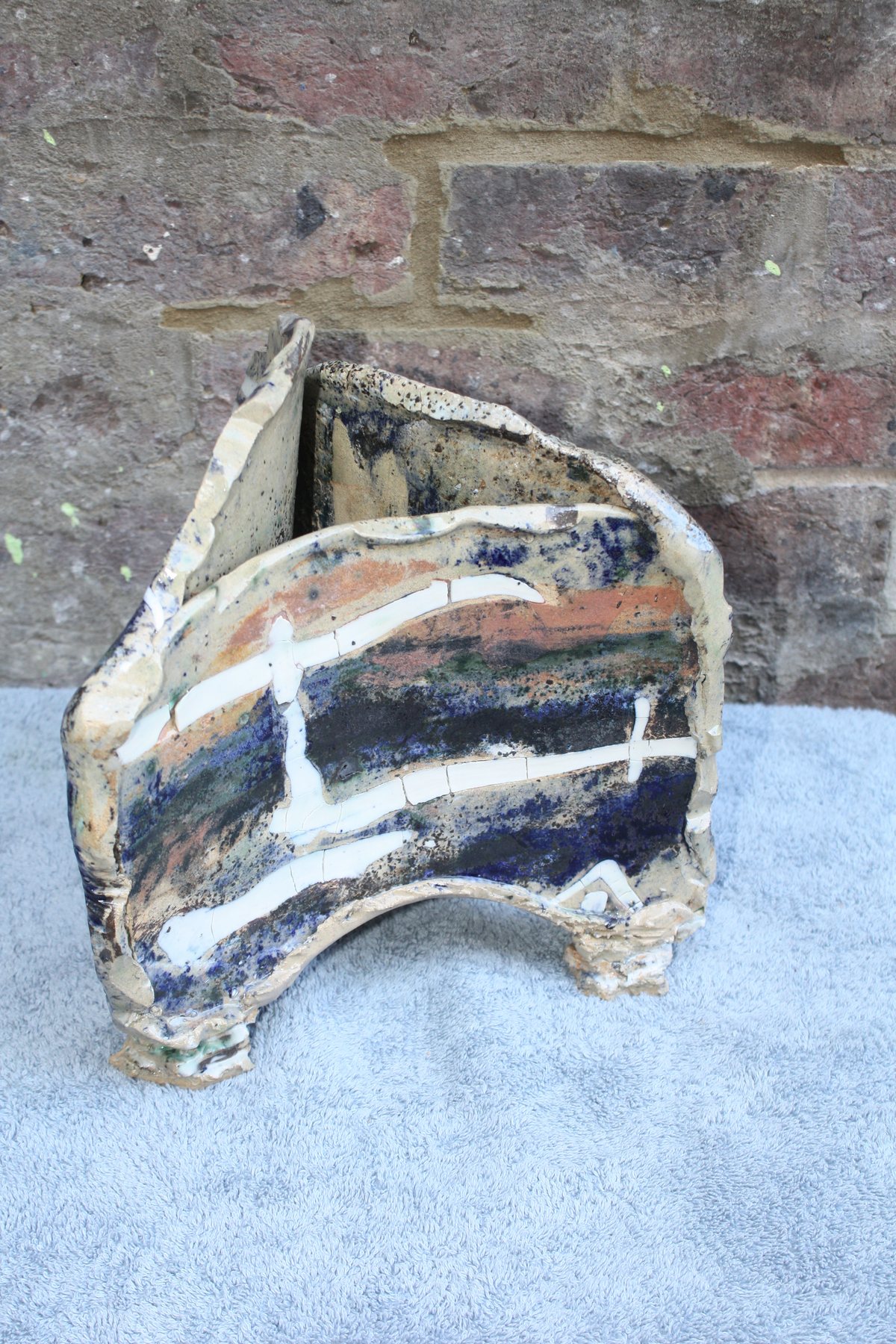 Triangular Strata Pot with inlaid porcelain and oxides by Graham Matthews
