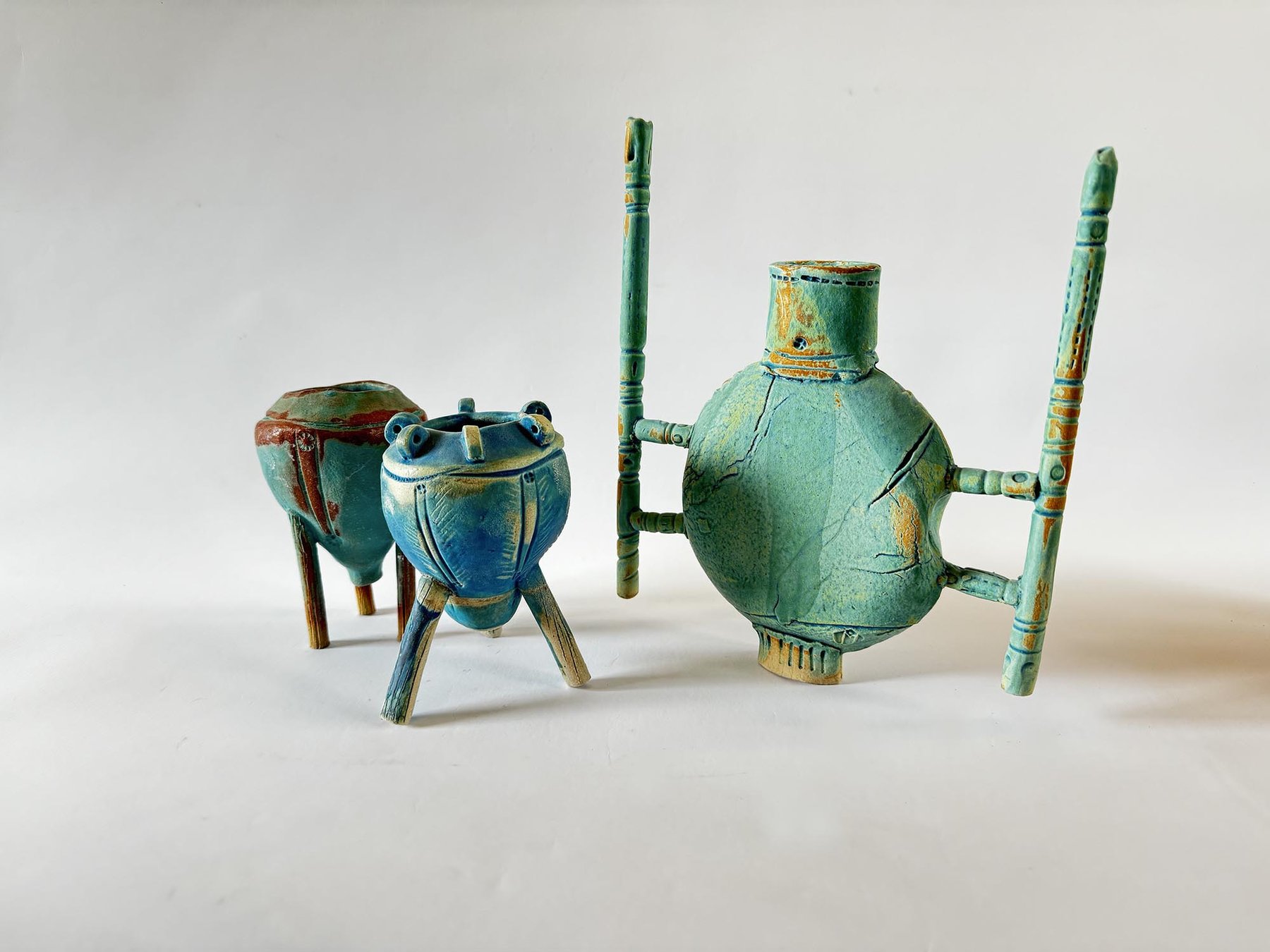 Three architectural tripod vessels in turquoise glaze by Graham Matthews